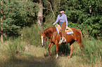 woman rides Quarter Horse