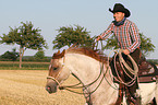 man rides Quarter Horse