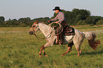 man rides Quarter Horse