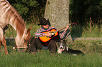 man with dog and horse