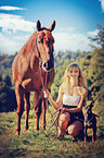 woman with dog and Quarter Horse