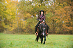 woman rides Quarter Horse