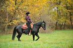 woman rides Quarter Horse