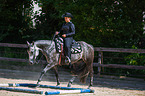 woman rides Quarter Horse