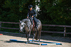 woman rides Quarter Horse