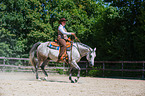 woman rides Quarter Horse