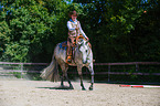 woman rides Quarter Horse