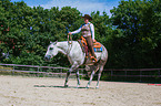 woman rides Quarter Horse