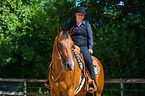 woman rides Quarter Horse