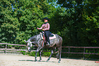 woman rides Quarter Horse