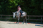 woman rides Quarter Horse