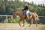 woman rides Quarter Horse