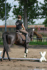 woman rides horse