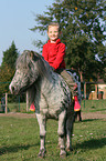 girl with shetland pony