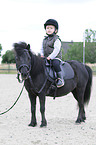 girl and Shetlandpony