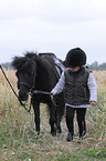 girl and Shetlandpony