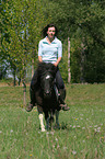 woman rides Shetland Pony