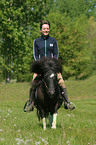 woman rides Shetland Pony