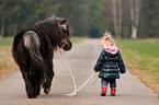 child and Shetland Pony