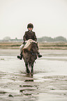 girl rides Shetland Pony