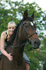 woman rides Thuringian warmblood