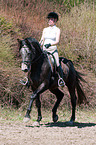 woman rides Trakehner