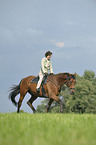 woman rides Trakehner