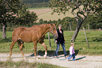 woman and child with horse