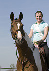 woman rides warmblood