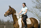 woman rides warmblood