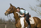 woman rides warmblood