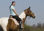 woman rides warmblood