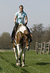 woman rides warmblood