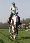 woman rides warmblood