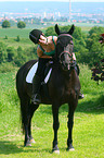 woman rides warmblood