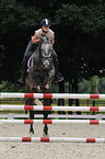 woman rides warmblood