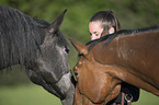 woman and 2 warmbloods