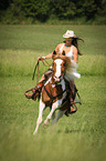 woman rides warmblood