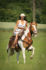 woman rides warmblood