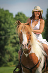 woman rides warmblood