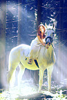 woman rides white horse