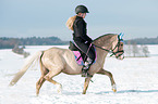 woman rides Welsh B