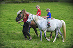 kids riding ponys