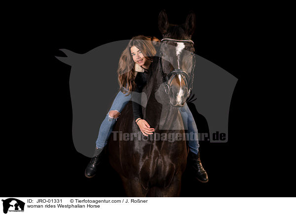 woman rides Westphalian Horse / JRO-01331