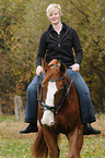 woman rides warmblood