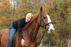 woman rides warmblood