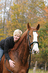 woman rides warmblood