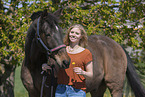 woman and Westphalian warmblood