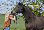 woman and Westphalian warmblood