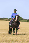 girl rides Tinker-Cross